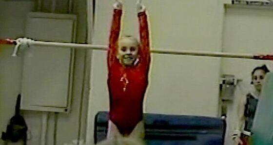 Finishing a bar routine with a salute