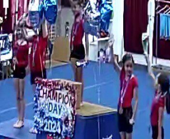 Champions with the Champion Day 2024 sign