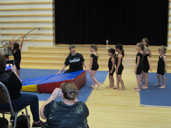 Coach Robin spotting a tumbler