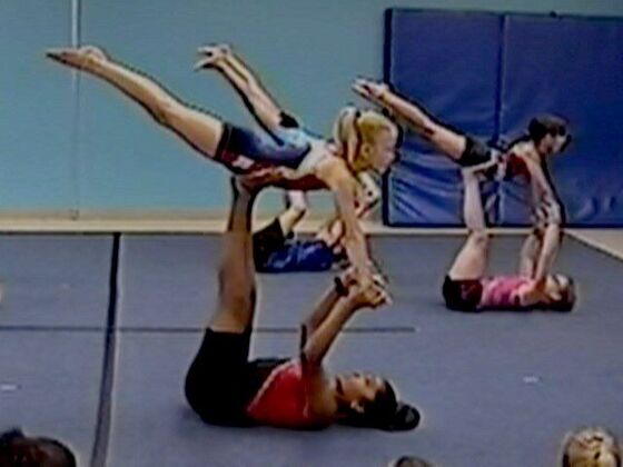 Cheer partners balancing together