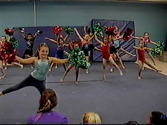 A cheer routine with pom-poms
