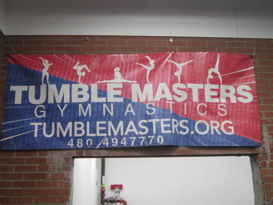 The Tumble Masters banner over the door