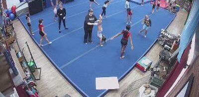 A class working with a coach on the spring floor, 2026