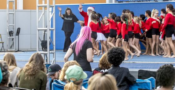 Coach Robin introducing Santa at the Tempe Marketplace Christmas Show
