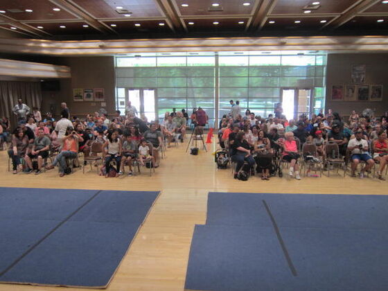 Moms and dads in the audience at the summer recital
